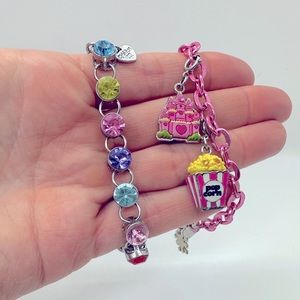 Two Charm It bracelets and two charms.